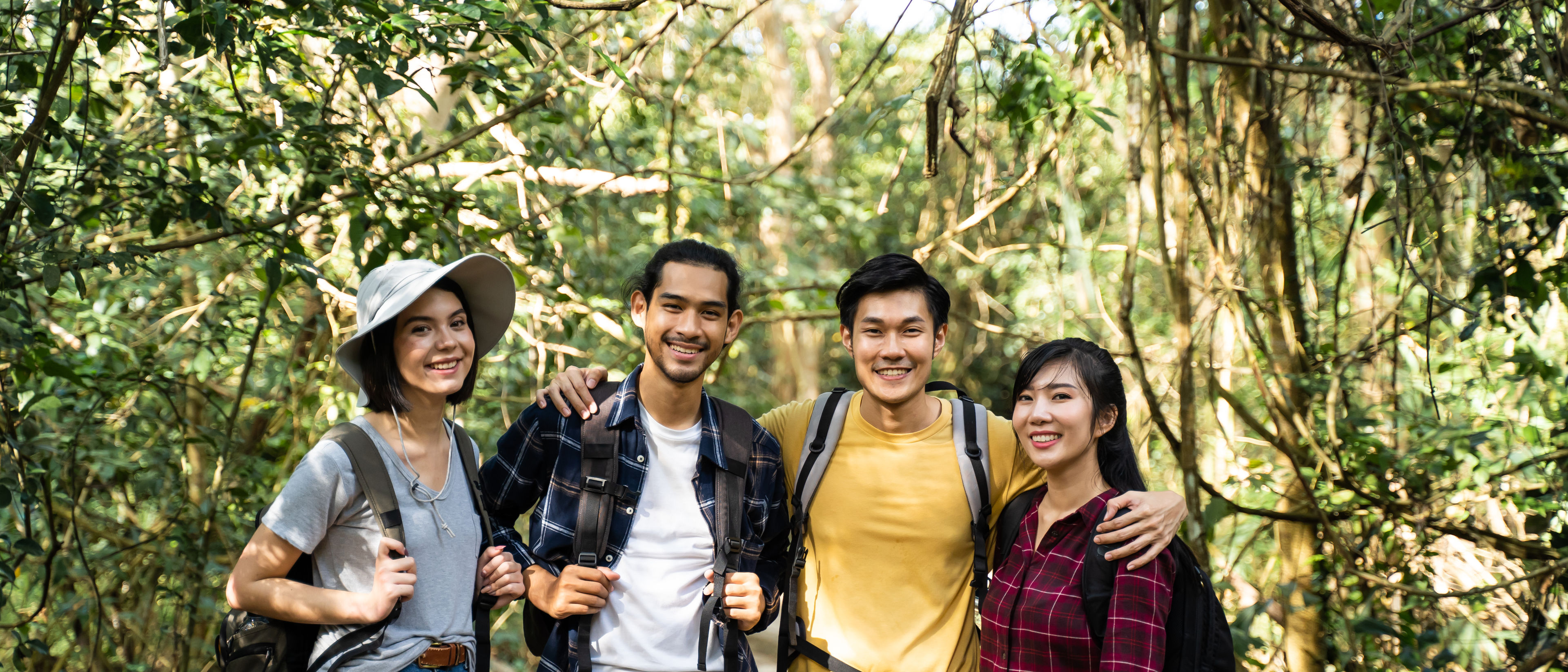 Group of friends travelling in the forest.
